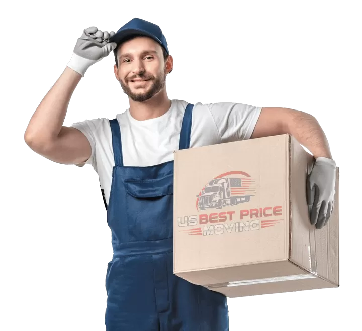 Smiling mover in blue overalls holding a box.